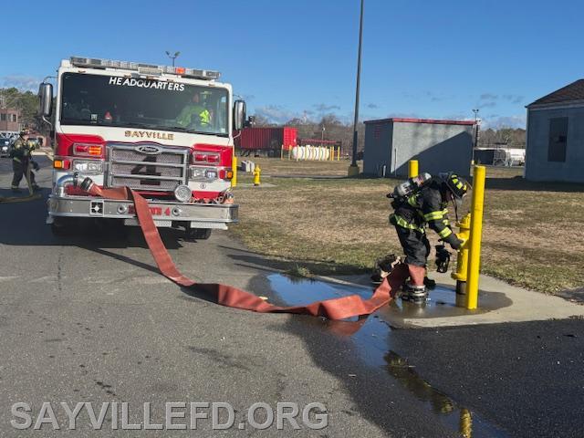 Practicing establishing a water supply at the fire academy!