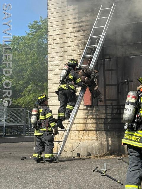 Practicing rescuing a victim from a second story at fireschool!